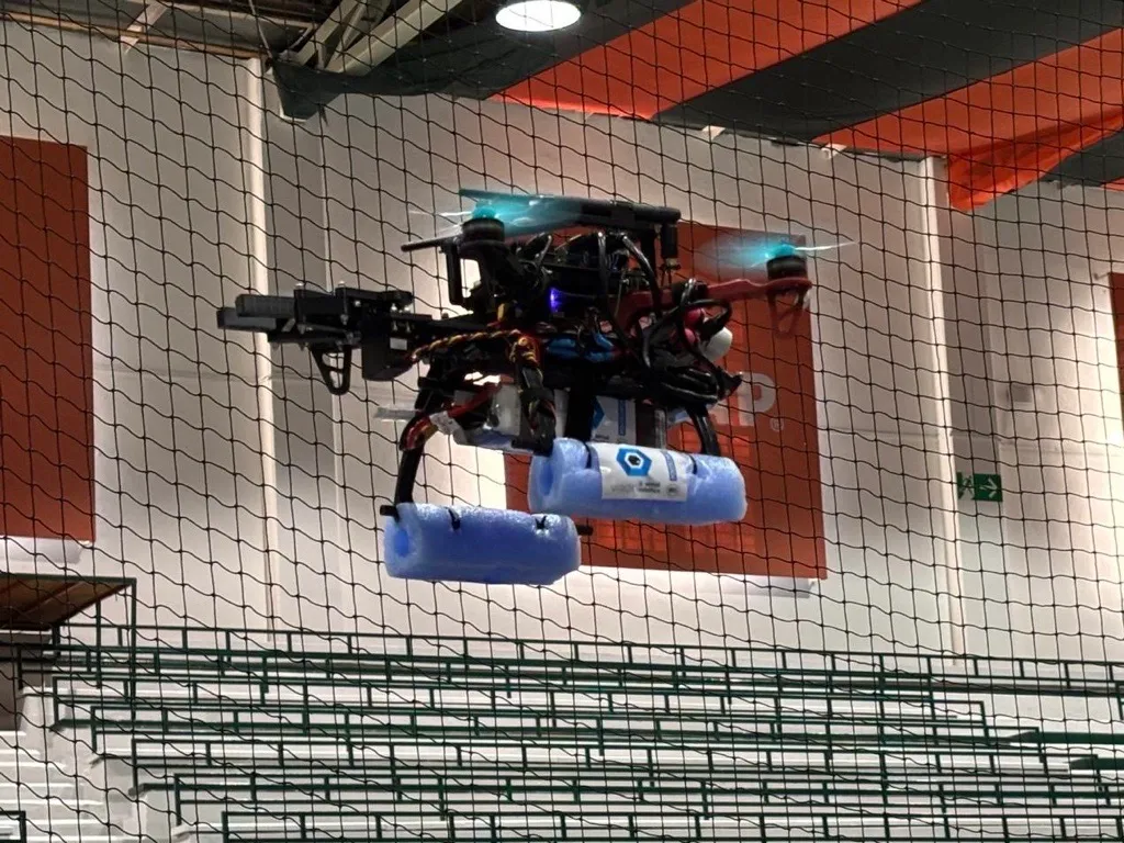 Drone carrying a payload during an indoor mission